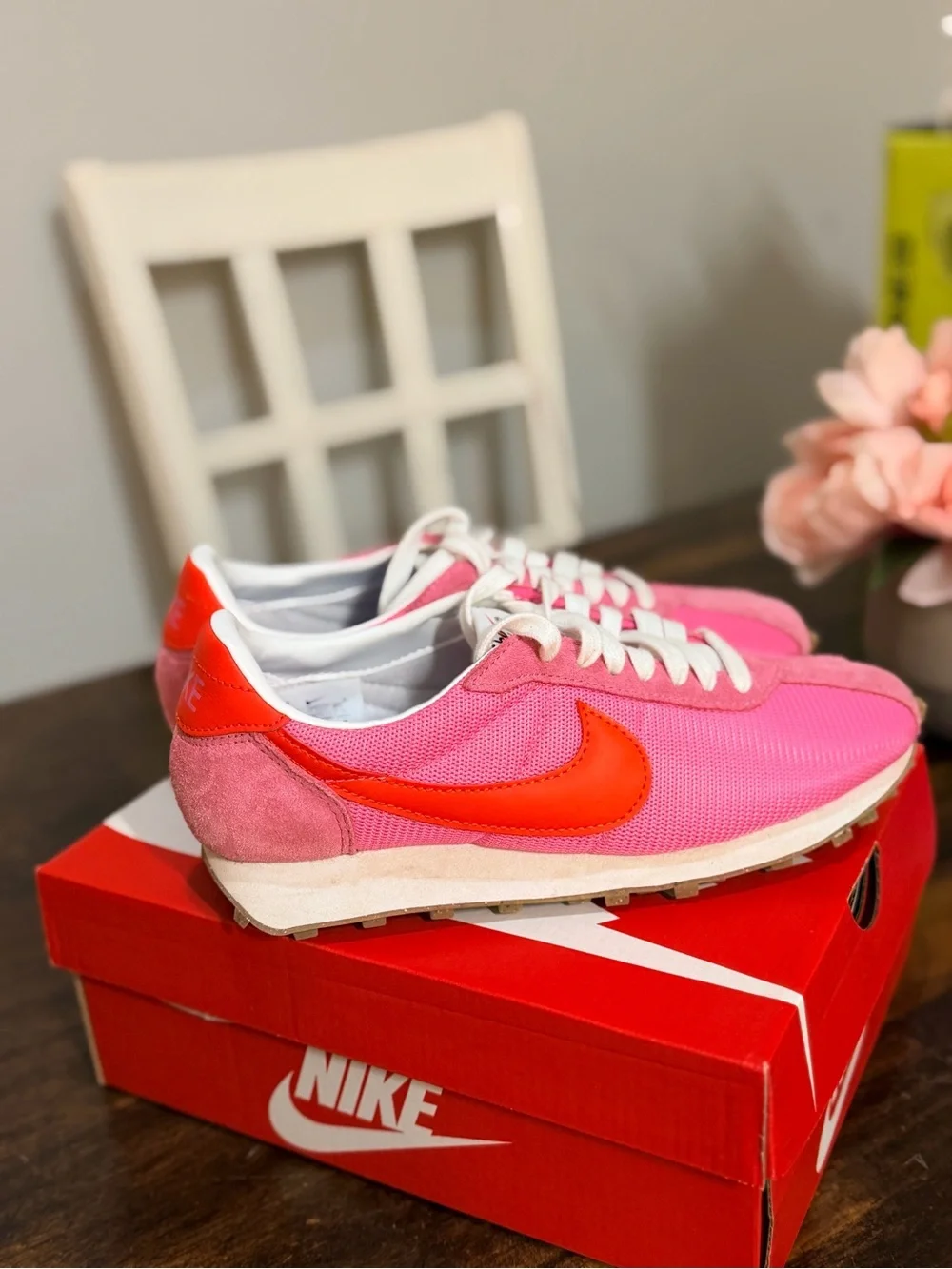 Nike Women's Pink Sneakers with Orange Swoosh